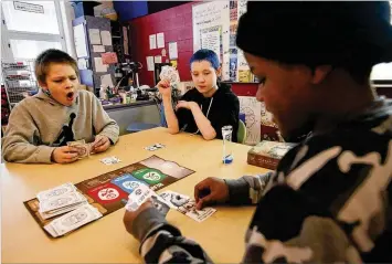  ?? TY GREENLEES / STAFF ?? Dayton Public Schools Ruskin PreK-6 School offers Miracle Makers after-school programs for its students. Supported by East End Services, the curriculum is hands-on, project-based learning. Students play games at the end of the school day, before their Miracle Makers program starts.