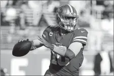  ?? JOSIE LEPE/AP PHOTO ?? San Francisco 49ers quarterbac­k Jimmy Garoppolo (10) looks to pass against the Atlanta Falcons during the first half of a game on December 15 at Santa Clara, Calif.