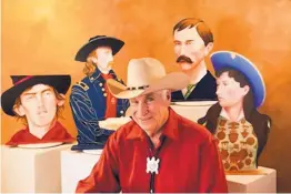  ??  ?? Maurice Turetsky with his steel cutouts, 2012, of Billy the Kid, George Armstrong Custer, Pat Garrett and Annie Oakley.