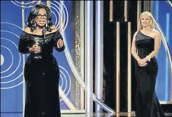  ?? REUTERS ?? Oprah Winfrey speaks after accepting the Cecil B Demille Award at the 75th Golden Globe Awards in Beverly Hills, California, on Sunday, as actor Reese Witherspoo­n looks on.
