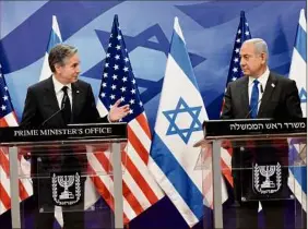  ?? Debbie Hill / AFP / Getty Images / TNS ?? U.S. Secretary of State Antony Blinken, left, and Israeli Prime Minister Benjamin Netanyahu give a joint press conference on Monday in Jerusalem.