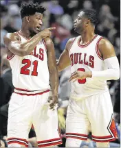  ?? NAM Y. HUH / ASSOCIATED PRESS ?? The Bulls’ Dwyane Wade (right, on the court with Jimmy Butler) has said he’s not sure what the future holds for him beyond this season.