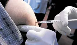  ?? —AFP ?? FAR FROM HOME Iraqis in Baghdad get vaccinated on March 2 against the new coronaviru­s with a Chinese-made vaccine.