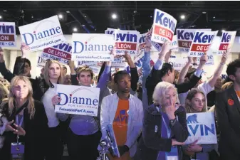  ?? Jenna Schoenefel­d / New York Times ?? State Sen. Kevin de León’s backers rally next to Sen. Dianne Feinstein supporters during the state Democratic Party convention. De León has been in second place in most polls.