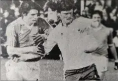  ??  ?? Seamus Morris puts pressure on Tommy Murphy.