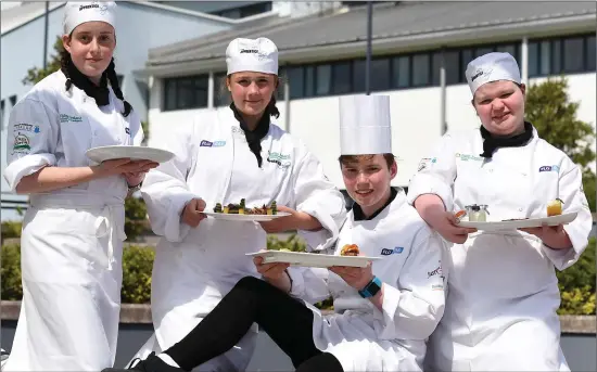  ?? Photo by Domnick Walsh ?? Flogas Supreme Apprentice Chef of the Year 17-year-old Padraic Randles from Kenmare serving up a winner at the IT Tralee north campus, pictured here with runners-up Lauren Wall, Emily O’Hara and Kelly English.