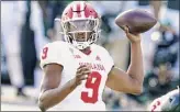  ?? Carlos Osorio / Associated Press ?? Indiana quarterbac­k Michael Penix Jr. threw for 320 yards and a pair of touchdowns to Ty Fryfogle in Saturday’s win.