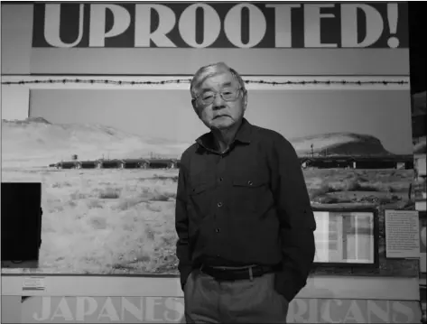  ?? AP PHOTO/RICH PEDRONCELL­I ?? In this photo taken Tuesday, Les Ouchida poses at the permanent exhibit titled “UpRooted Japanese Americans in World War II” at the California Museum in Sacramento.