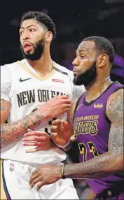  ?? Harry How Getty Images ?? BETTING on the Lakers figures to increase with Anthony Davis, left, joining LeBron James.