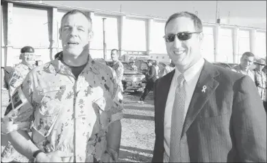  ?? Postmedia News ?? Maj.-gen. Mike Day, left, shares a laugh with Canada’s visiting Defence Minister Peter Mackay in Afghanista­n on Nov. 12.