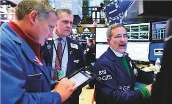  ?? AP ?? ■ The New York Stock Exchange. Some markets gave back early gains ahead of the Fed’s first decision on interest rates since the appointmen­t of its new chair, Jerome Powell.