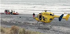  ?? TADHG STOPFORD/SUPPLIED ?? Emergency services at the Bowentown end of Waih¯ı Beach after a shark attacked a woman while she was swimming.