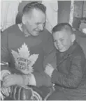  ?? FRANK LENNON/TORONTO STAR FILE PHOTO ?? Johnny Bower is seen with son John Jr. in 1963. Bower died Tuesday, age 93.