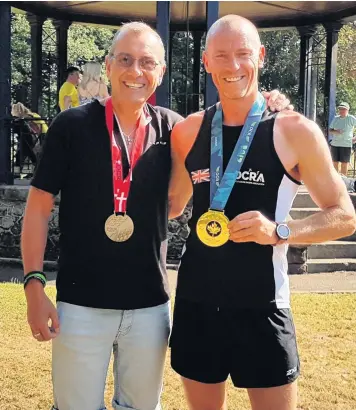  ??  ?? World OCR champion Jasonu Burgess, right, took part in the Brough Park Santa Dash, along with a good turnout of other runners in the festive spirit.