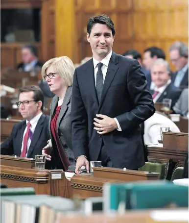 ?? JUSTIN TANG/THE CANADIAN PRESS ?? Prime Minister Justin Trudeau rises to vote during a marathon session in the House of Commons Friday, after the Conservati­ves vowed to call 259 votes of confidence in protest of being denied access to the national security adviser.