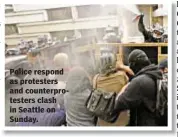  ??  ?? Police respond as protesters and counterpro­testers clash in Seattle on Sunday.