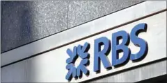  ?? DANIEL LEAL-OLIVAS/AFP ?? An RBS logo is pictured abouve a branch of a Royal Bank of Scotland (RBS) bank branch in central London.