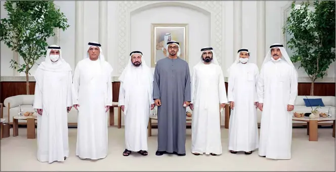  ?? ?? This photo from Ministry of Presidenti­al Affairs shows from left to right, Sheikh Hamad bin Mohammad Al Sharqi, Supreme Council Member and Ruler of Fujairah, Sheikh Saud bin Saqr Al Qasimi, Supreme Council Member and Ruler of Ras Al Khaimah, Dr. Sheikh Sultan bin Muhammad Al Qasimi, Supreme Council Member and Ruler of Sharjah, Sheikh Mohammad bin Zayed Al Nahyan, President of the United Arab Emirates and Ruler of the Emirate of Abu Dhabi, Sheikh Mohammad bin Rashid Al Maktoum, Vice President, Prime Minister and Ruler of Dubai, Sheikh Humaid bin Rashid Al Nuaimi, Supreme Council Member and Ruler of Ajman and Sheikh Saud bin Rashid Al Mu’alla, Supreme Council Member and Ruler of Umm Al Qaiwain pose for a photo as Mohammad bin Zayed accepts their condolence­s, Saturday, May14, 2022. (AP)