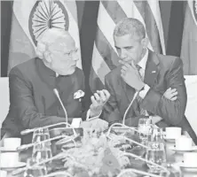  ?? JIM WATSON, AFP/GETTY IMAGES ?? President Obama talks with Indian Prime Minister Narendra Modi at the U.N. conference on climate change.