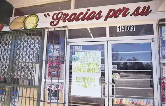  ?? ROBERTO E. ROSALES/JOURNAL ?? Several businesses along Isleta Blvd. in Albuquerqu­e, including the Rio Grande Vegetable and Groceries store, closed Thursday in support of immigrant workers. TOP: In Santa Fe, the Tune Up Cafe, left, and Tia Sophia’s were among businesses that closed.