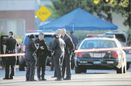  ?? Irfan Khan Los Angeles Times ?? POLICE GATHER at the scene where Officer Brian Van Gorden killed motorist Sergio Navas after a 2015 car chase ended in Burbank.