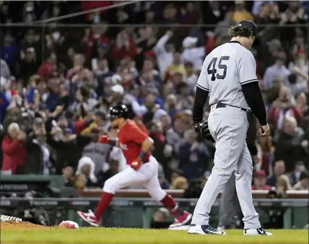  ?? CHARLES KRUPA — THE ASSOCIATED PRESS ?? New York Yankees starting pitcher Gerrit Cole (45) reacts as Boston Red Sox’s Kyle Schwarber rounds third base after hitting a solo homer in the third inning of an American League Wild Card playoff baseball game at Fenway Park, Tuesday, Oct. 5, 2021, in Boston.