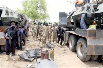  ??  ?? Chief of Army Staff, Lt.- Gen. Tukur Buratai, inspecting armoured personnel carriers during his assessment of ongoing manufactur­ing, repairs and overhaul of combat vehicles at the 107 Division equipment support in Maimalari Barracks, Maiduguri … at the weekend.