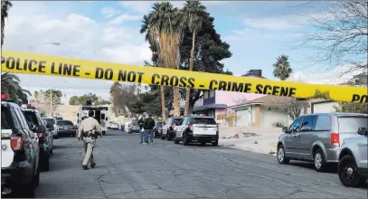 ?? Rio Lacanlale ?? Las Vegas Review-journal Las Vegas police investigat­e where a man was found shot to death at 4323 Del Santos Drive in east Las Vegas early Monday. It was the second fatal shooting at that address since December.