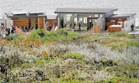  ?? Photos by Michael Macor / The Chronicle ?? The new Lands End Lookout occupies a rugged perch above the ruins of Sutro Baths in San Francisco. The Lookout offers views of the Pacific Ocean with a forested backdrop on the other three sides. Inside is a visitors center, cafe and gift shop.