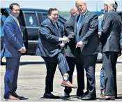  ??  ?? Billy Nungesser, the lieutenant governor of Louisiana, shows off his Donald Trump socks to the US president in the city of Lake Charles yesterday