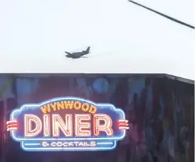  ?? —AP ?? MIAMI: This Aug. 4, 2016 photo shows a plane conducts mosquito control aerial spraying over Wynwood.