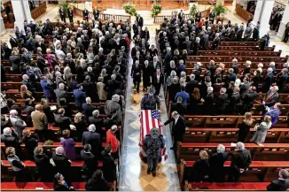  ?? JOHN AMIS / FOR ATLANTA JOURNAL-CONSTITUTI­ON ?? A man touches the casket bearing Zell Miller, former Georgia governor and U.S. senator, at Tuesday’s memorial service at Peachtree Road United Methodist Church in Atlanta. Miller, a conservati­ve Democrat, died at 86 of complicati­ons of Parkinson’s...