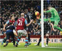  ??  ?? BIRMINGHAM: West Ham United goalkeeper Adrian clears off the line during the English Premier League soccer match against Aston Villa at Villa Park, Birmingham, England, yesterday. — AP