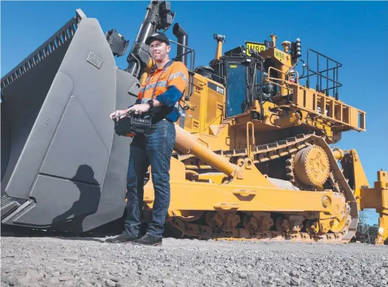  ?? Picture: DARREN ENGLAND ?? Hastings Deering, which supplies equipment including Caterpilla­r bulldozers, is optimistic about 2018.