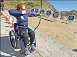  ??  ?? (Right) Hanna Bailey takes aim Saturday during the 2019 Olympic Day event.