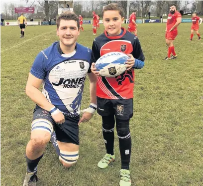  ??  ?? Under 10s match day mascot, Zac Ransom, pictured with Blues captain Mike Finnemore