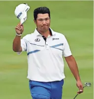  ?? ASSOCIATED PRESS ?? Hideki Matsuyama tips his hat as he walks to the 18th green during the final round of the Bridgeston­e Invitation­al on Sunday at Firestone Country Club in Akron, Ohio.