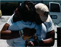  ?? PHOTO COURTESY OF TRACEY IVEY ?? Georgia Tech freshman defensive end Jared Ivey gives his mother, Tracey, a hug as she gets ready to leave after setting up his dorm room over the weekend.