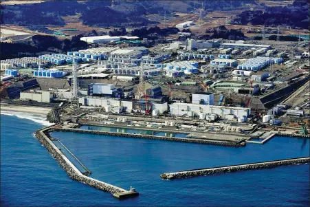  ?? REUTERS ?? Storage tanks for treated radioactiv­e water at the tsunami-crippled Fukushima Daiichi nuclear power plant in Okuma, Fukushima prefecture, Japan, as seen on Tuesday.