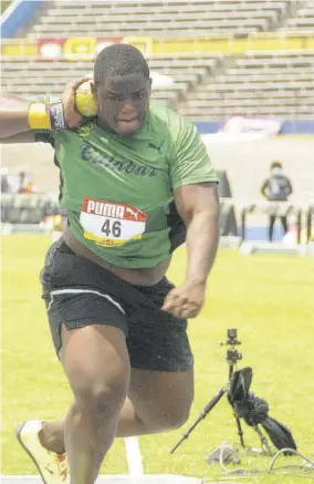  ??  ?? Kobe Lawrence of Calabar High competes to win the Class One shot put with 19.00m.