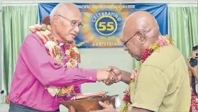  ?? Picture: RAMA ?? Archbishop Emeritus the Rev Dr Winston Halapua (left) receives his gift from Prof Dr Gwayawen Kiki during the event.