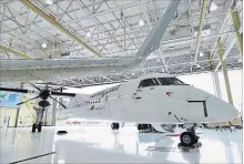  ?? AARON VINCENT ELKAIM THE CANADIAN PRESS ?? The company said it will sell its Q400 turboprop aircraft program to a subsidiary of Longview Aviation Capital Corp.