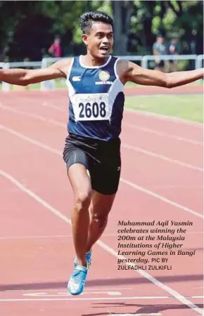  ?? PIC BY ZULFADHLI ZULKIFLI ?? Muhammad Aqil Yasmin celebrates winning the 200m at the Malaysia Institutio­ns of Higher Learning Games in Bangi yesterday.