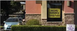  ?? ASSOCIATED PRESS ARCHIVES ?? California bosses added 842,000employe­es in 2022, roughly all the workers in New Mexico or Idaho. Seen here is a hiring sign at a Taco Bell in Sacramento.