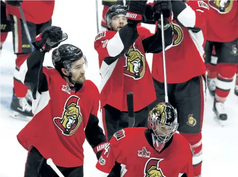  ?? FRED CHARTRAND/THE CANADIAN PRESS ?? Ottawa’s Mark Stone, left, Bobby Ryan, rear, and goalie Craig Anderson celebrate their 2-1 victory over the Pittsburgh Penguins in Game 6 of the Eastern Conference final Tuesday in Ottawa.