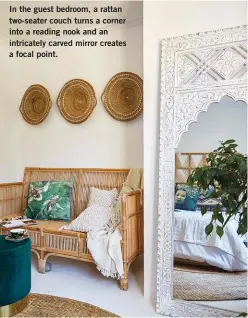  ??  ?? In the guest bedroom, a rattan two-seater couch turns a corner into a reading nook and an intricatel­y carved mirror creates a focal point.