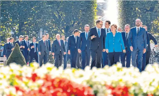  ?? JOE KLAMAR AFP/GETTY IMAGES ?? German Chancellor Angela Merkel, centre, with other leaders at the EU Informal Summit of Heads of State or Government in Salzburg, Austria on Thursday.