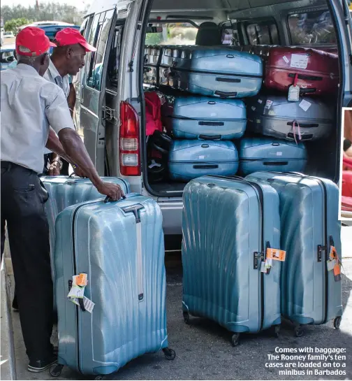  ??  ?? Comes with baggage: The Rooney family’s ten cases are loaded on to a minibus in Barbados