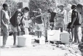  ??  ?? Tshabalala residents have gone for days without water.The picture taken recently shows some of the residents fetching water from a borehole in the suburb