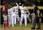  ?? RAY CHAVEZ — BAY AREA NEWS GROUP FILE ?? The Oakland Athletics' Chad Pinder (10) celebrates his solo home run with Stephen Piscotty (25) against the Los Angeles Angels in the ninth inning at the Coliseum in Oakland on Aug. 9, 2022.